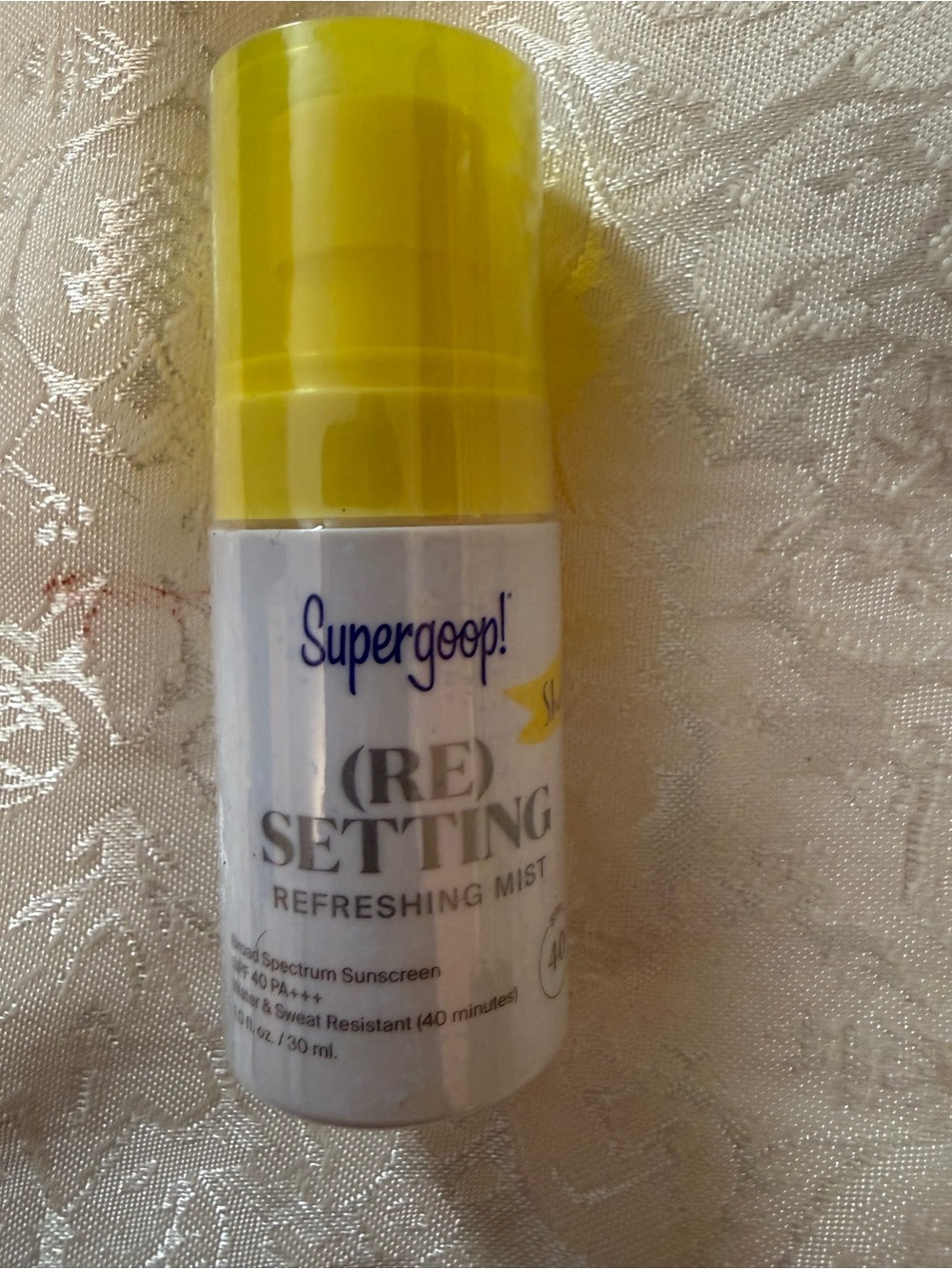 1 fl oz bottle of Supergoop! (Re)Setting Refreshing Mist broad spectrum SPF 40